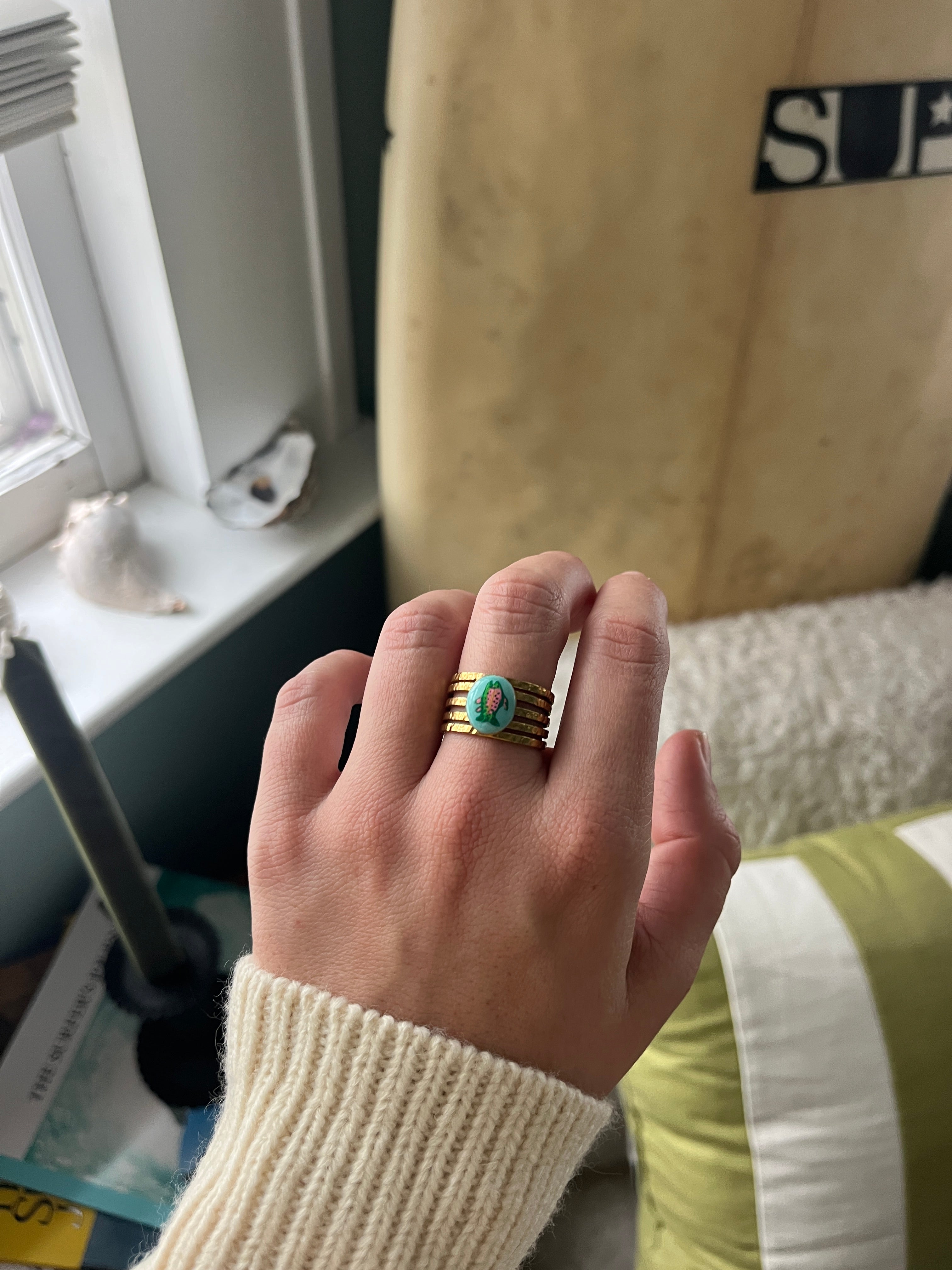 Trout Ring with turquoise background